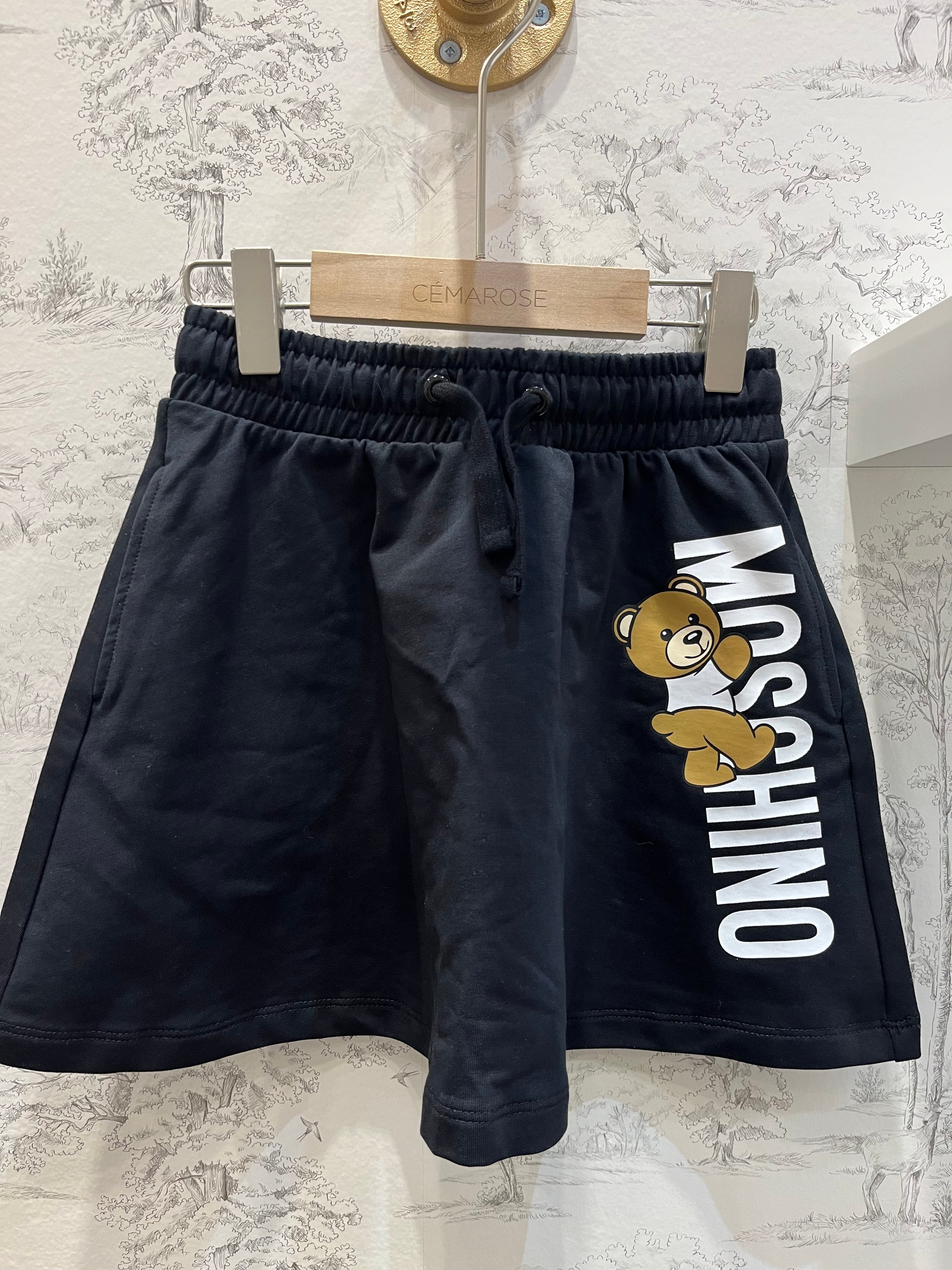 GIRL SKIRT WITH BEAR CLIMBING UP THE LOGO